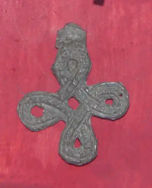 An old cross pendant in the shape of a bowen cross